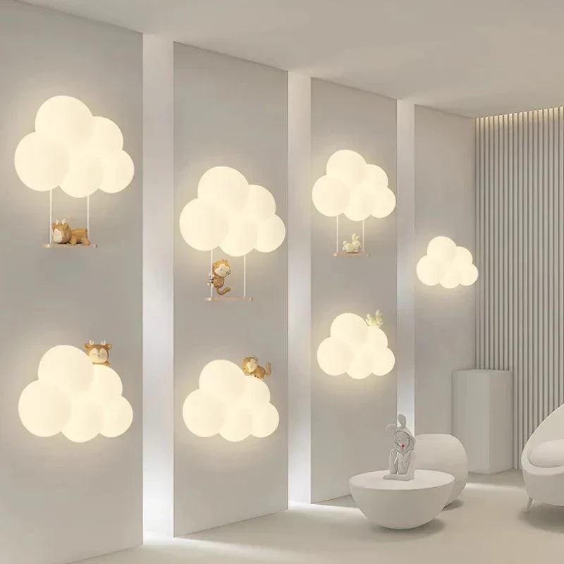 Children's LED wall lamp with cloud and animal motifs glowing on a showroom wall
