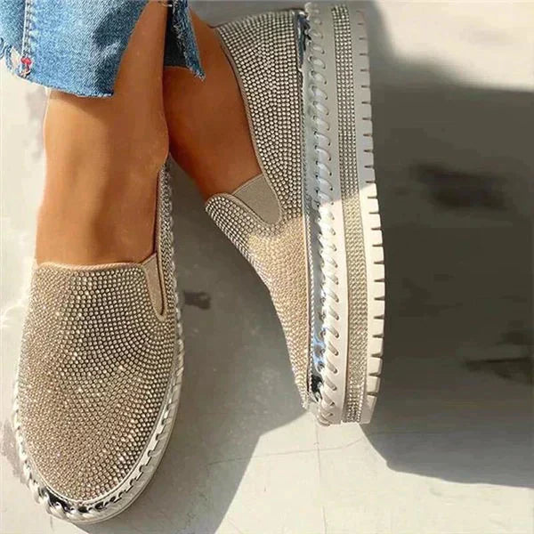 Side profile of sparkling platform loafers showing textured sole