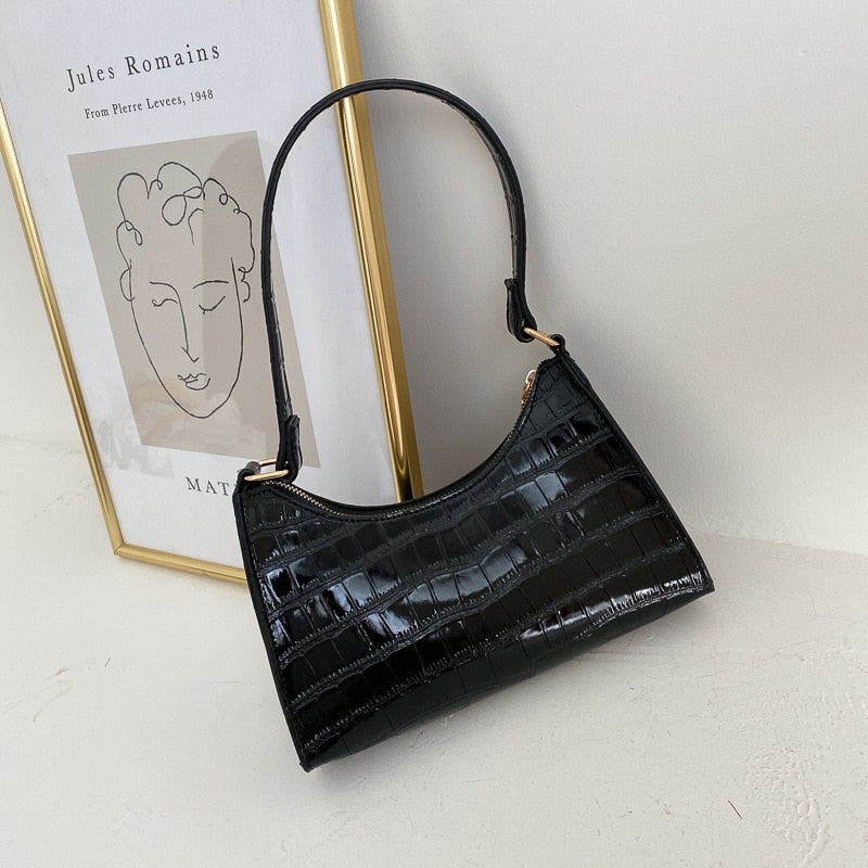 Interior lining and branded fabric detail inside luxury women's handbag