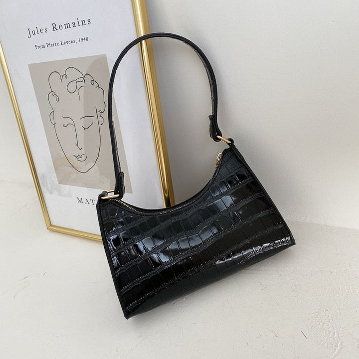 Interior lining and branded fabric detail inside luxury women's handbag