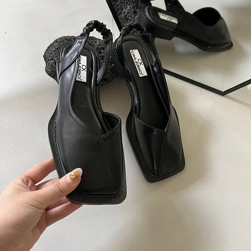 Model wearing trendy slingback sandals with elegant summer outfit