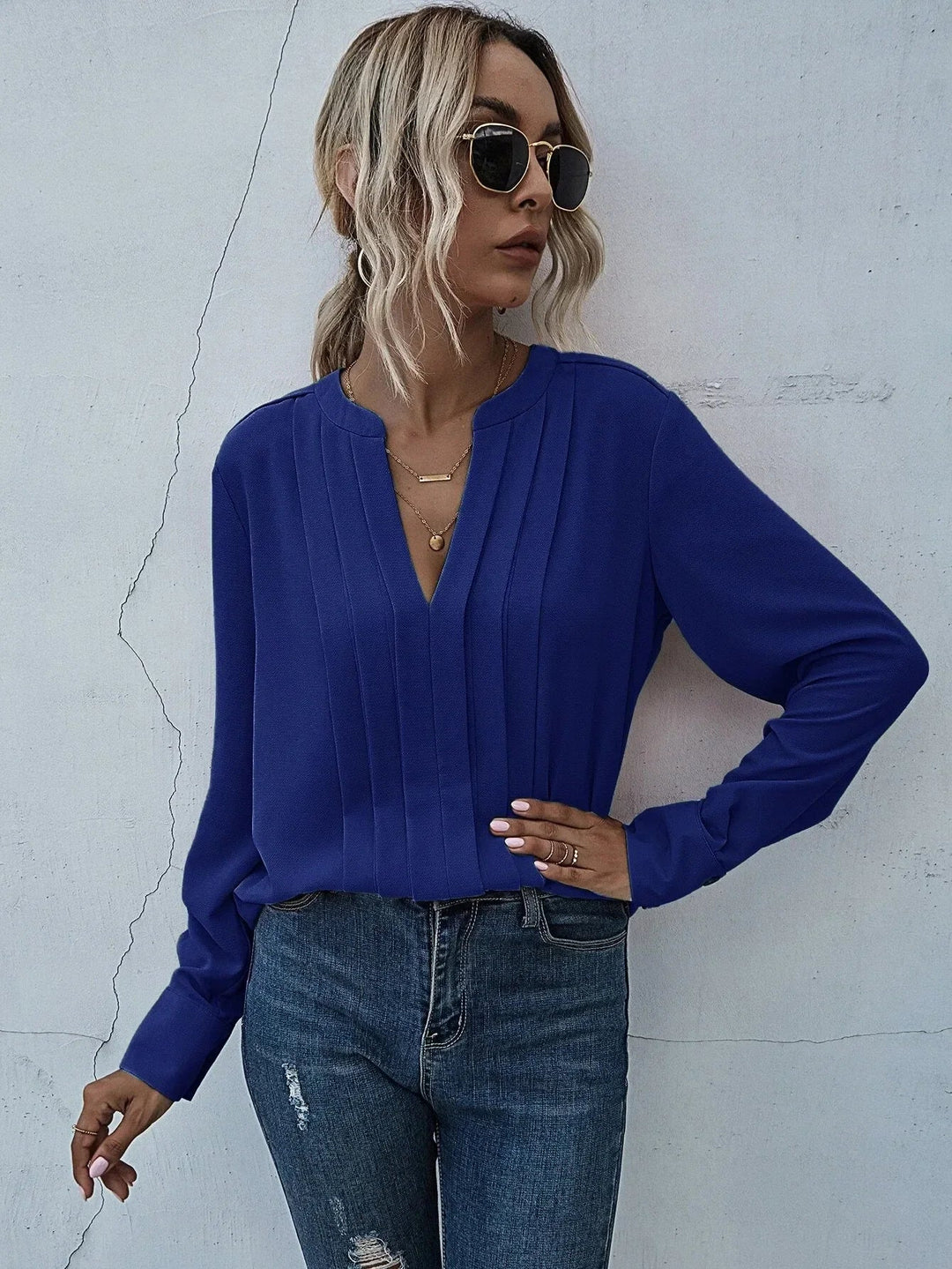 Full angle of the chic pleated blouse suitable for work or evening events