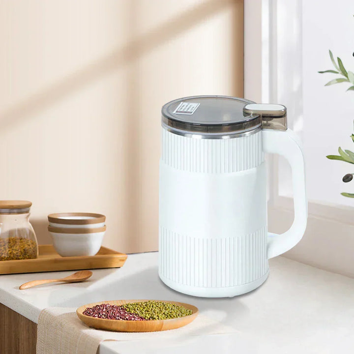 Modern electric spice grinder showing transparent lid and button