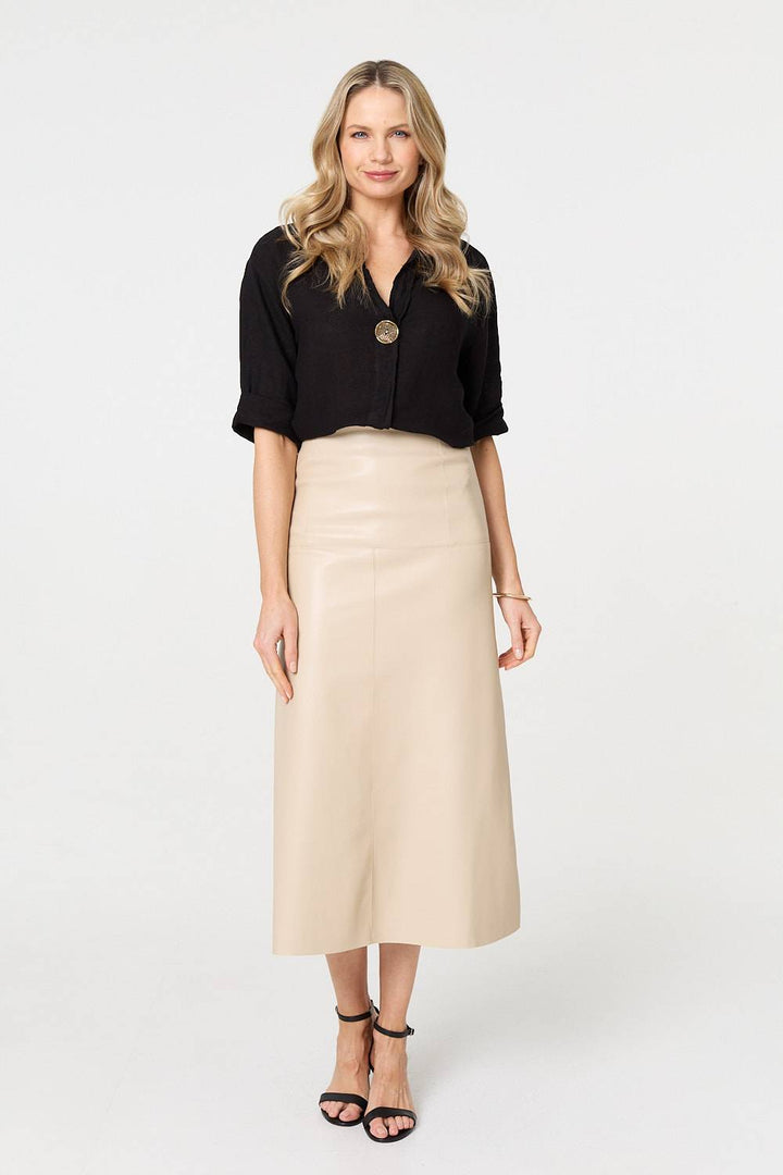 Casual styling idea for women's black high waist midi skirt
