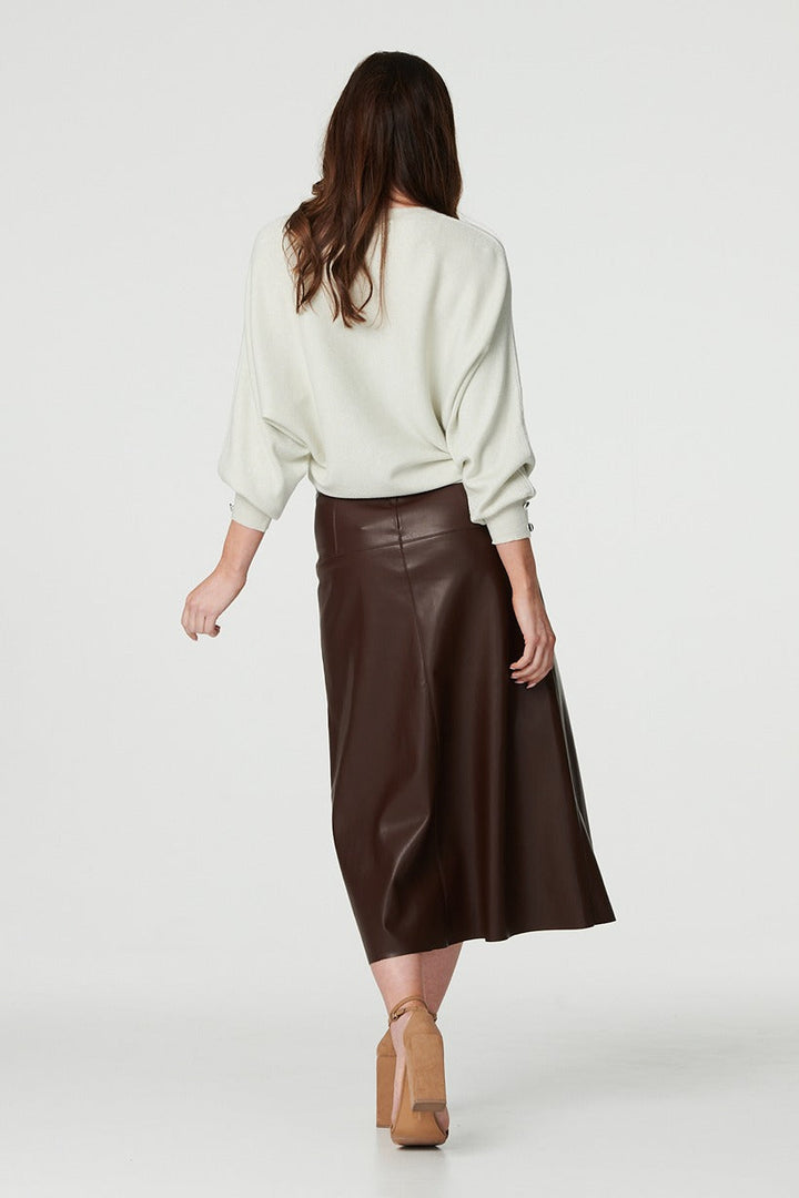 Detailed view of waistband on brown high waist midi skirt