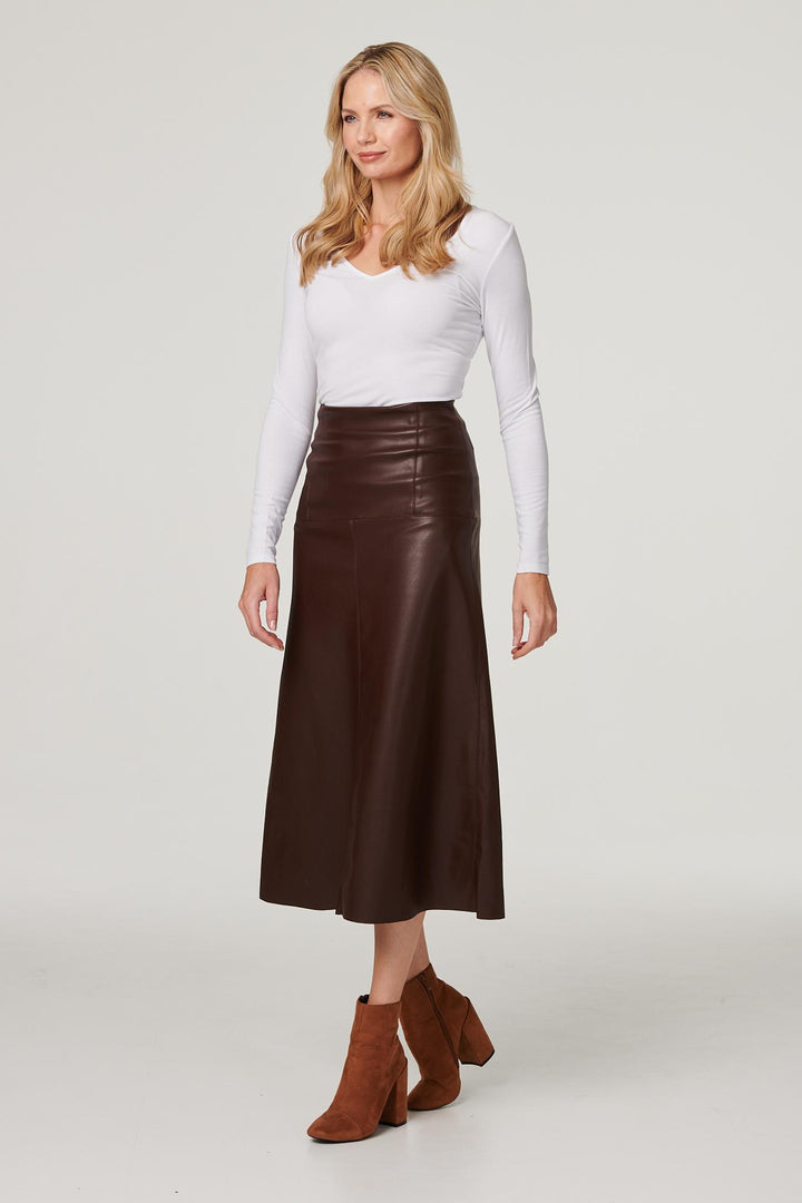 Plus size women's black midi skirt styled for the office