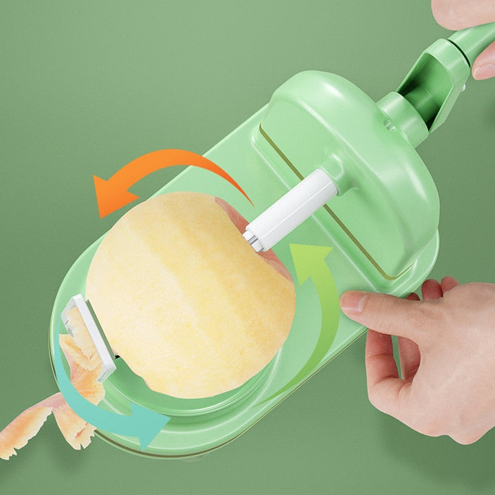 Top view of lime green fruit peeler in action peeling an apple