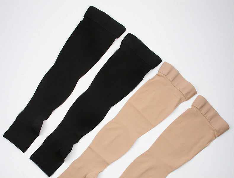 Unisex black thigh high compression stockings for leg support and recovery