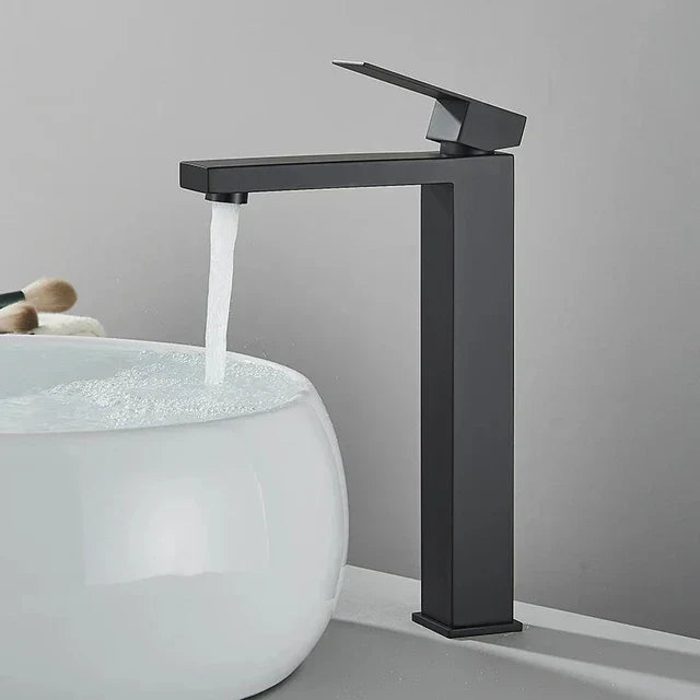 Tall black and silver mixer tap installed on a bathroom vanity