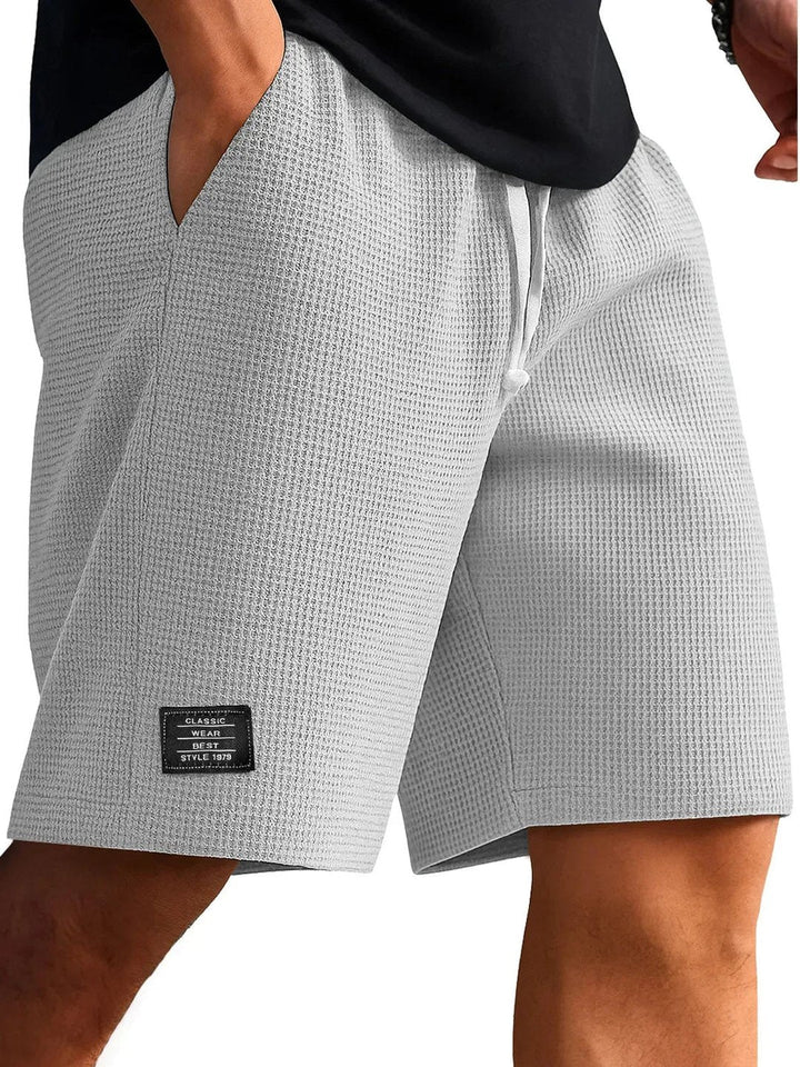 Back view of men's activewear shorts featuring secure pocket detail