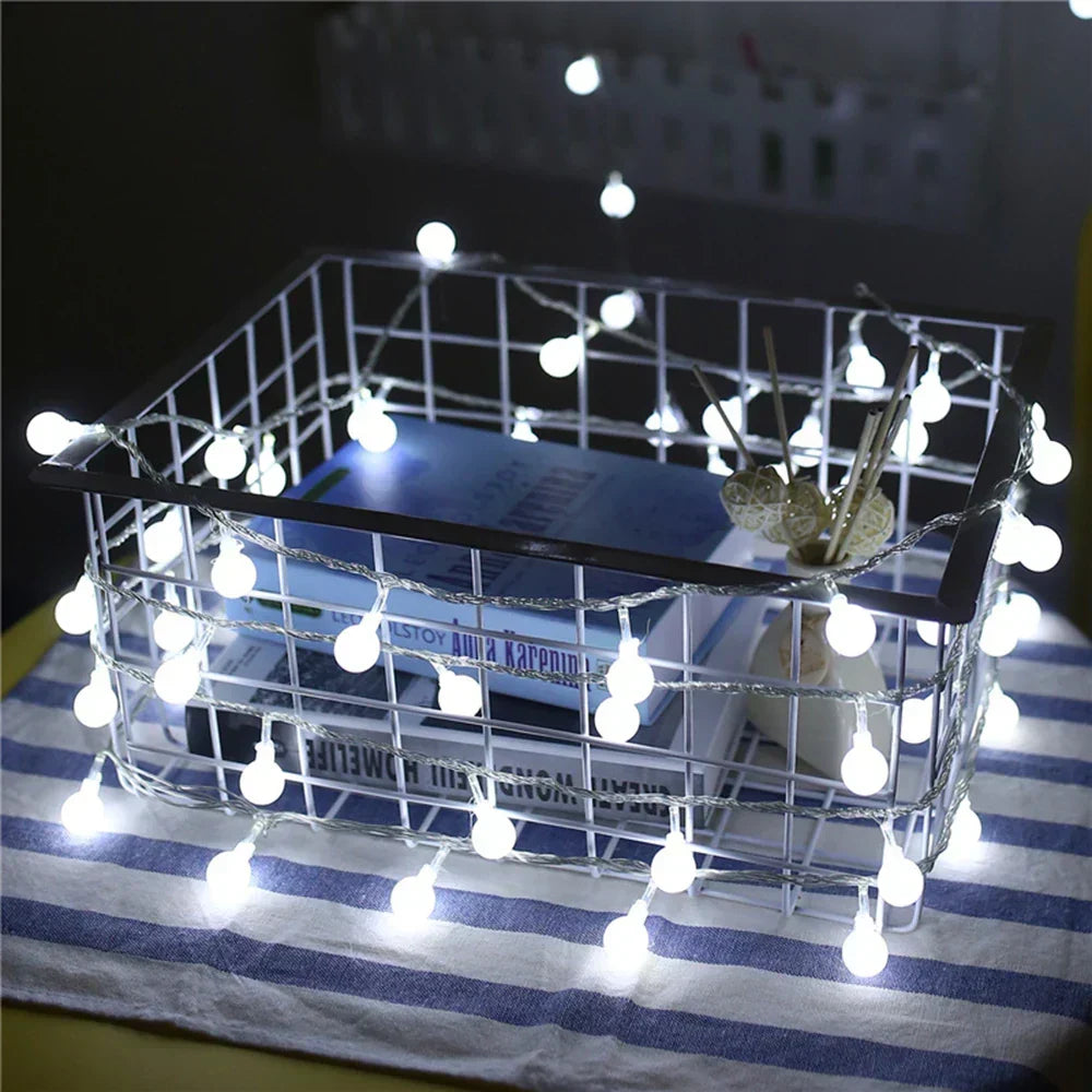 Close up of glowing LED string lights on a wall, ideal for wedding decor and party lights