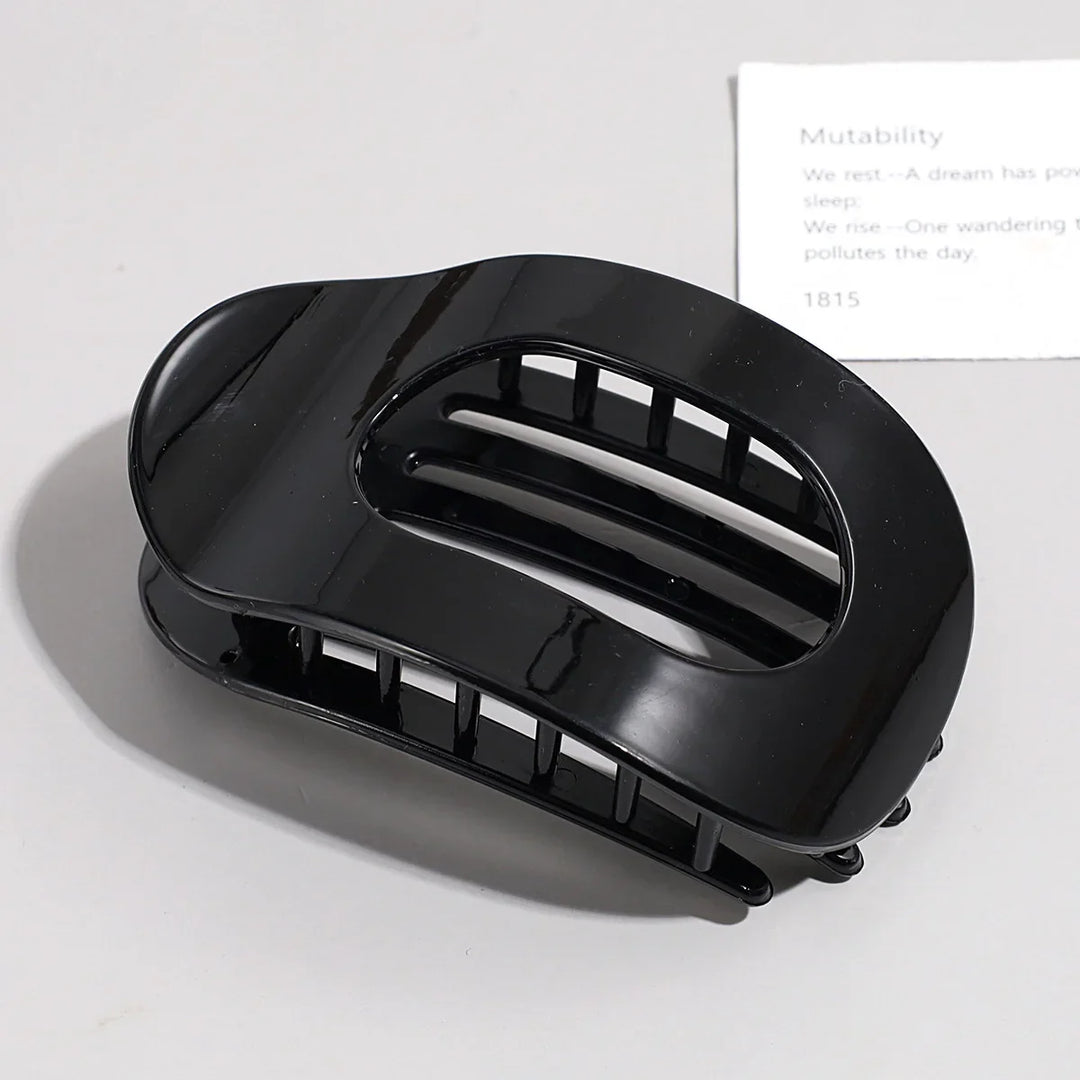 Elegant matte hair claw clip adding a chic touch to hairstyles
