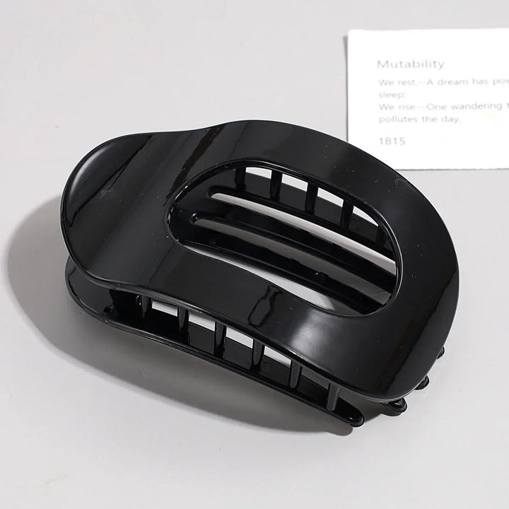 Elegant matte hair claw clip adding a chic touch to hairstyles