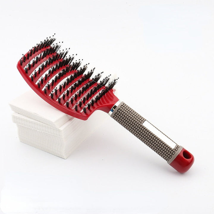 Compact styling tool hairbrush shown from angled perspective