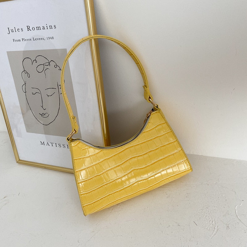 Stylish women's handbag paired with evening wear for a sophisticated outfit