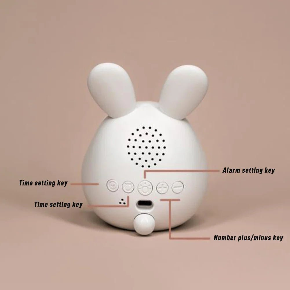 Side view of the portable bunny night light clock for children's bedrooms