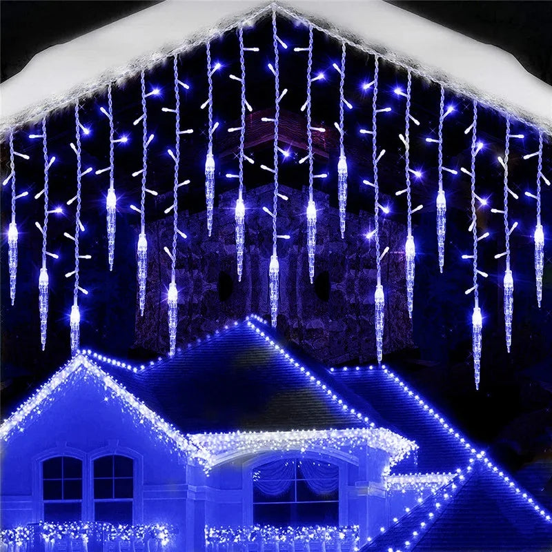 Blue LED icicle fairy light chain hanging on house facade