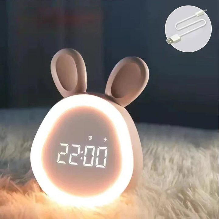 Pink children's bunny alarm clock with glowing LED ring and charging cable