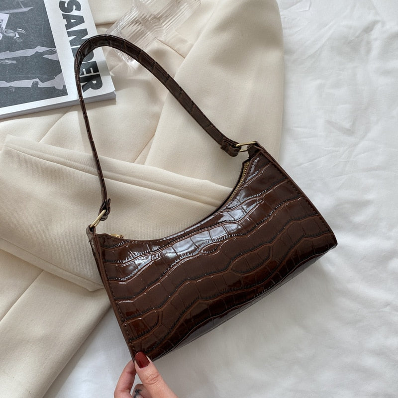 Versatile shoulder bag worn crossbody for hands-free convenience and style