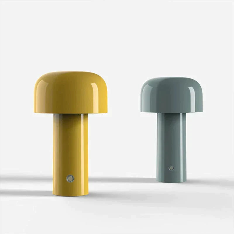 Portable cordless table lamp placed on a wooden nightstand as a bedside light