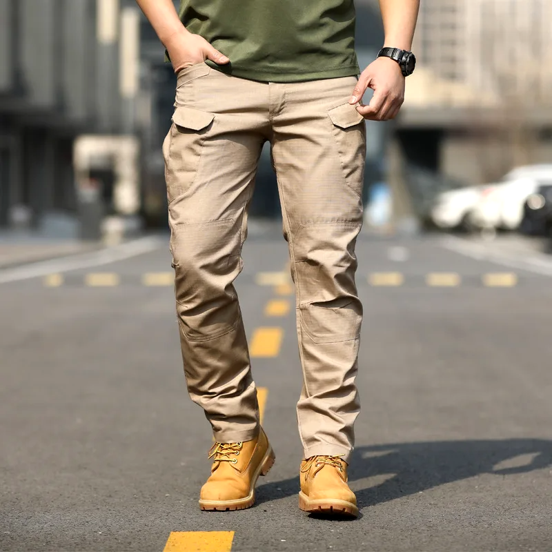 Detailed shot of ankle cuffs on khaki mens outdoor cargo trousers