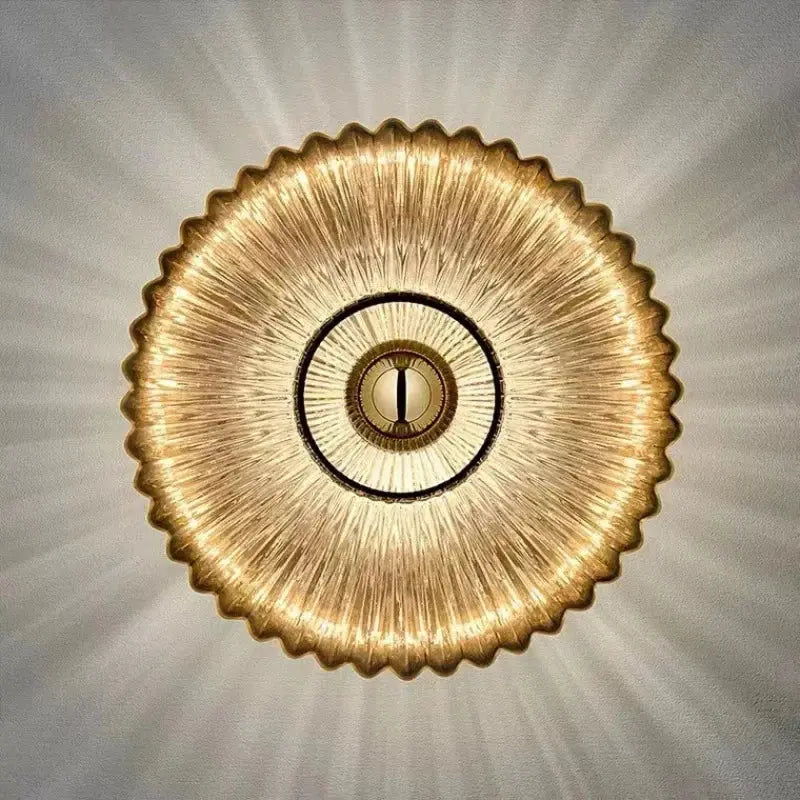 Front direct view of modern circular glass wall sconce with warm lighting