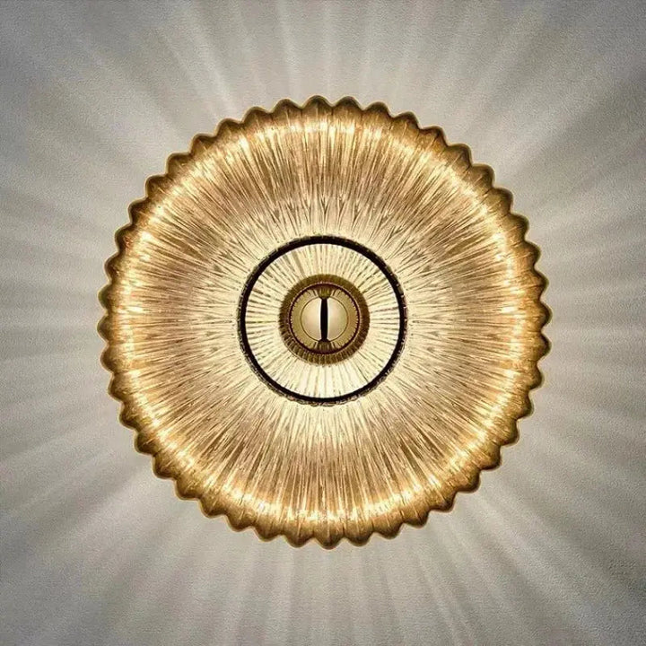 Front direct view of modern circular glass wall sconce with warm lighting