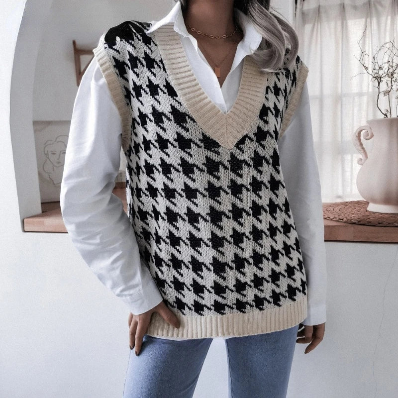 Detailed hemline of women's checked sweater waistcoat