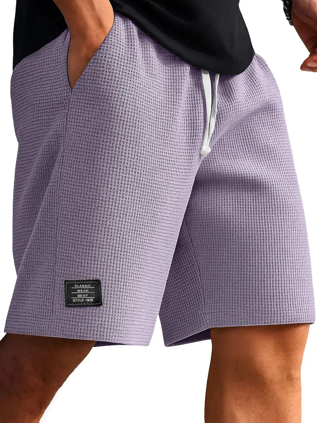 Elastic waistband detail on men's breathable summer shorts for active wear