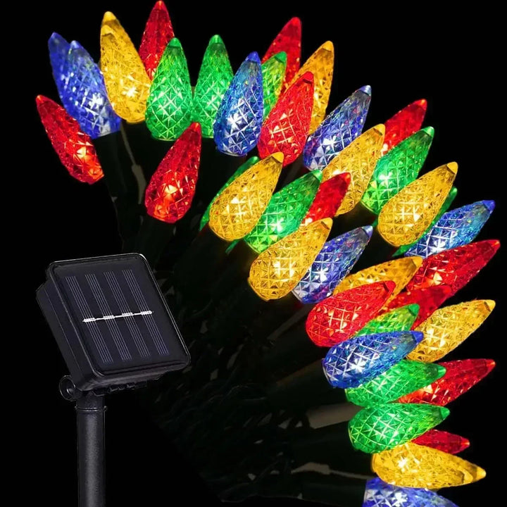 Vibrant multicolour strawberry LED string lights glowing against a dark background