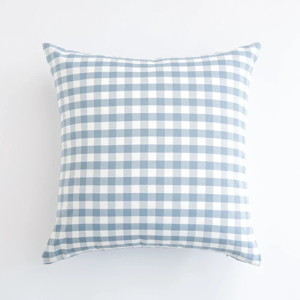 Blue and white checkered square cushion cover on white background