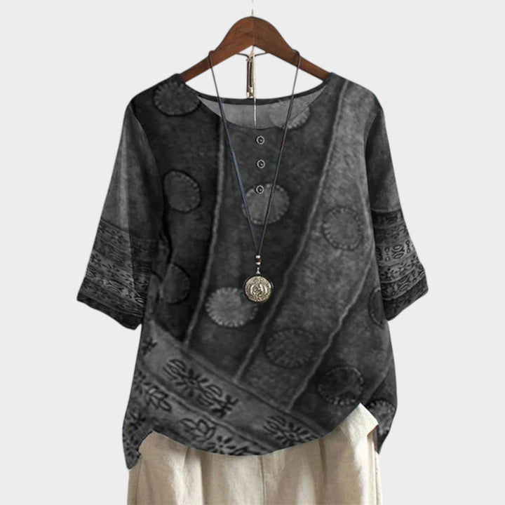 Women's grey patterned short sleeve vintage blouse on wooden hanger