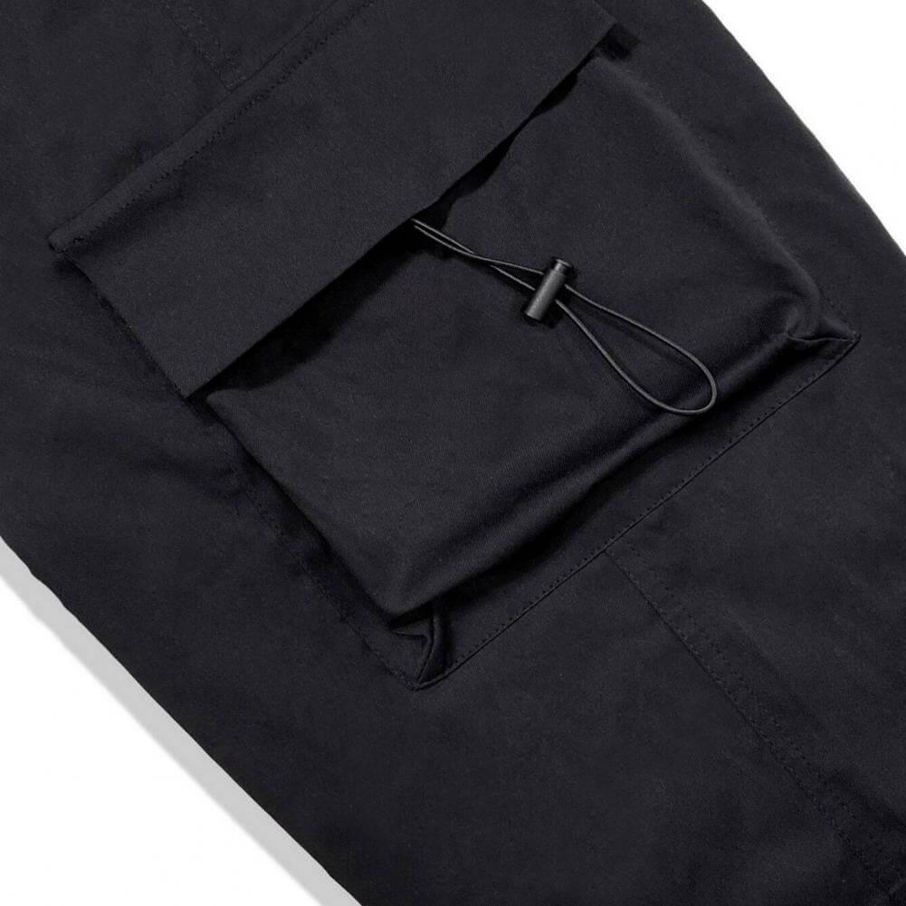 Streetwear pants detailed shot of secure cargo pocket snap button closure