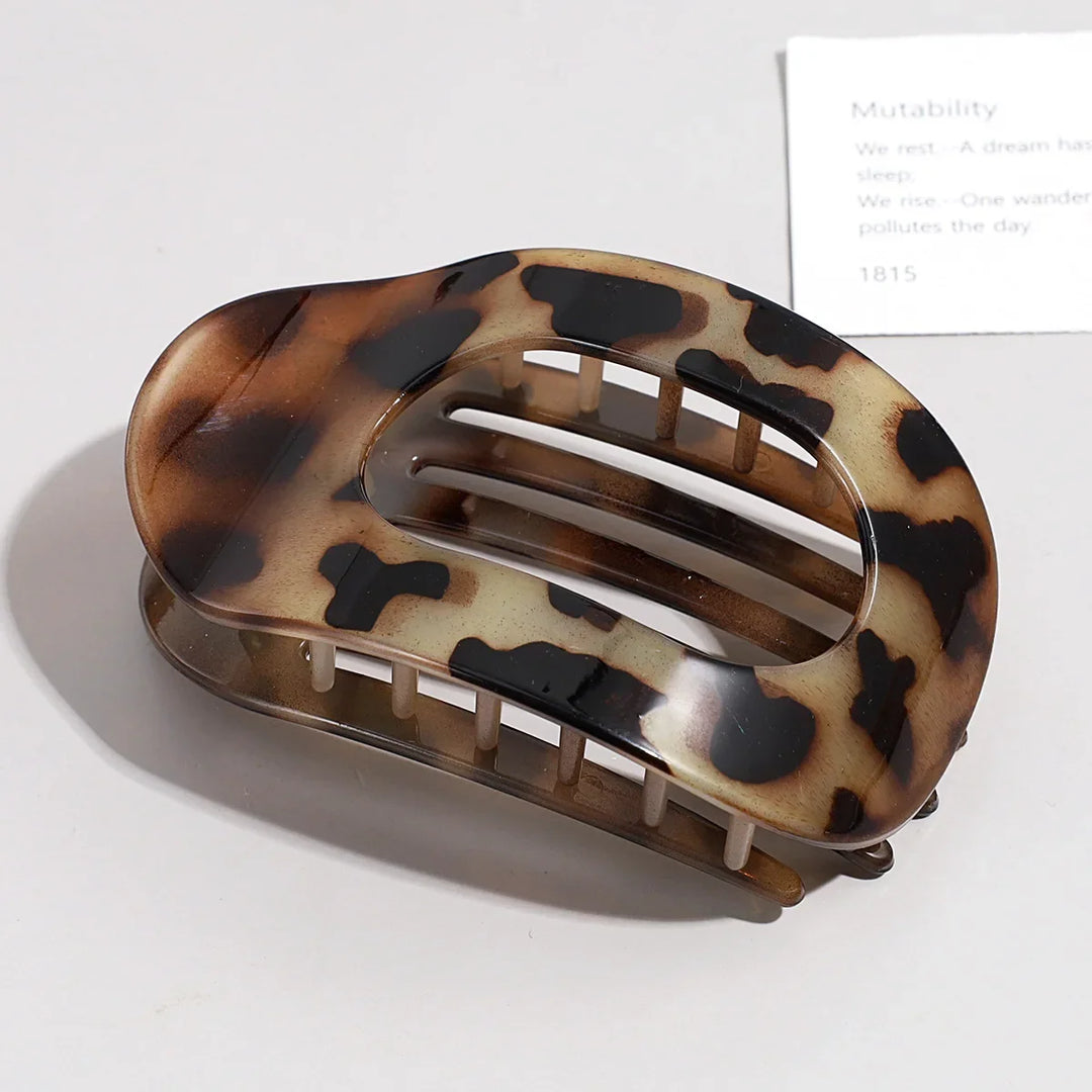 Versatile flat oval hair claw clip displayed for daily outfit styling