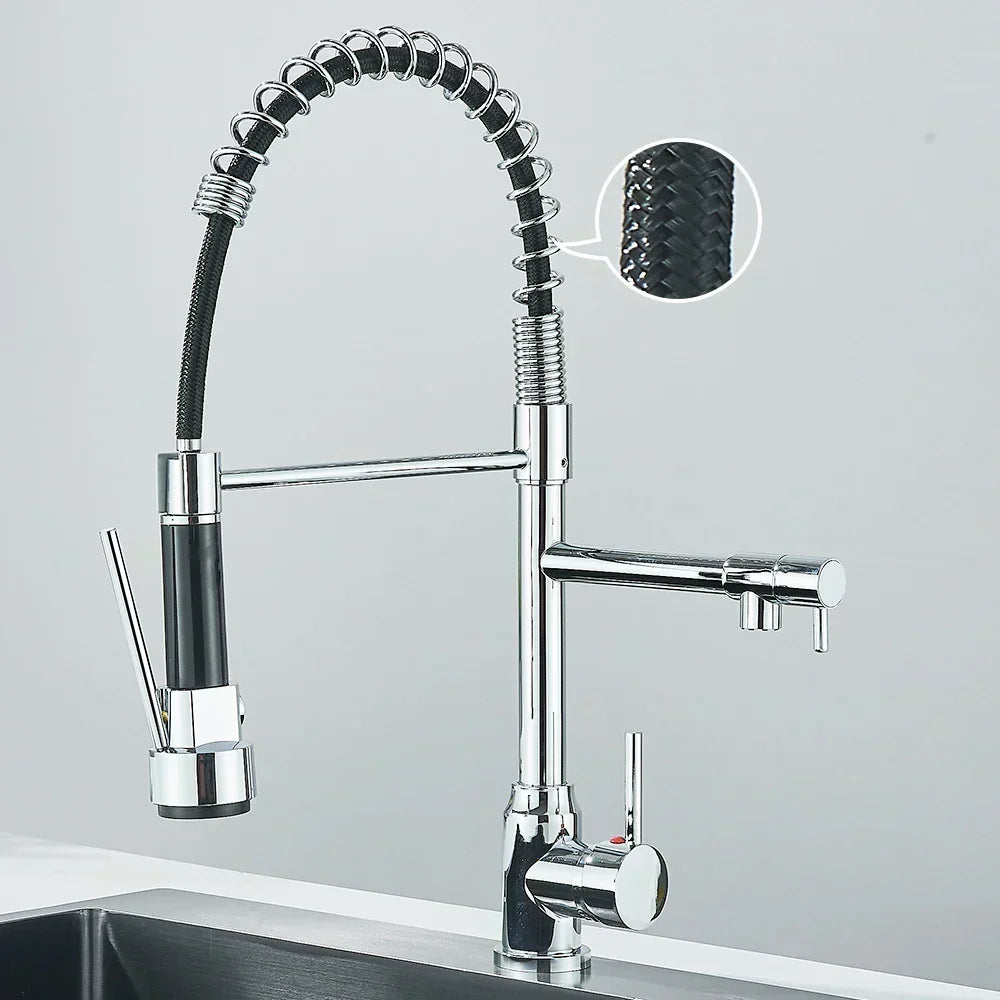 Close-up of flexible spout on contemporary kitchen mixer tap