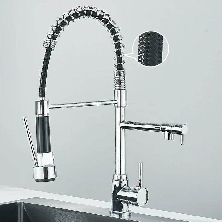Close-up of flexible spout on contemporary kitchen mixer tap