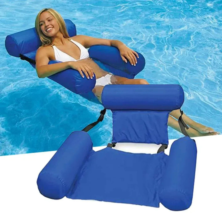 Dark blue inflatable water chair floating in a swimming pool with a woman relaxing