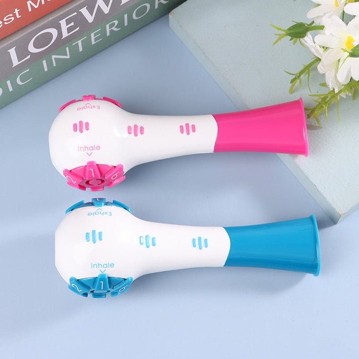 Side profile of the blue and pink lung exercise tools with clear markings.