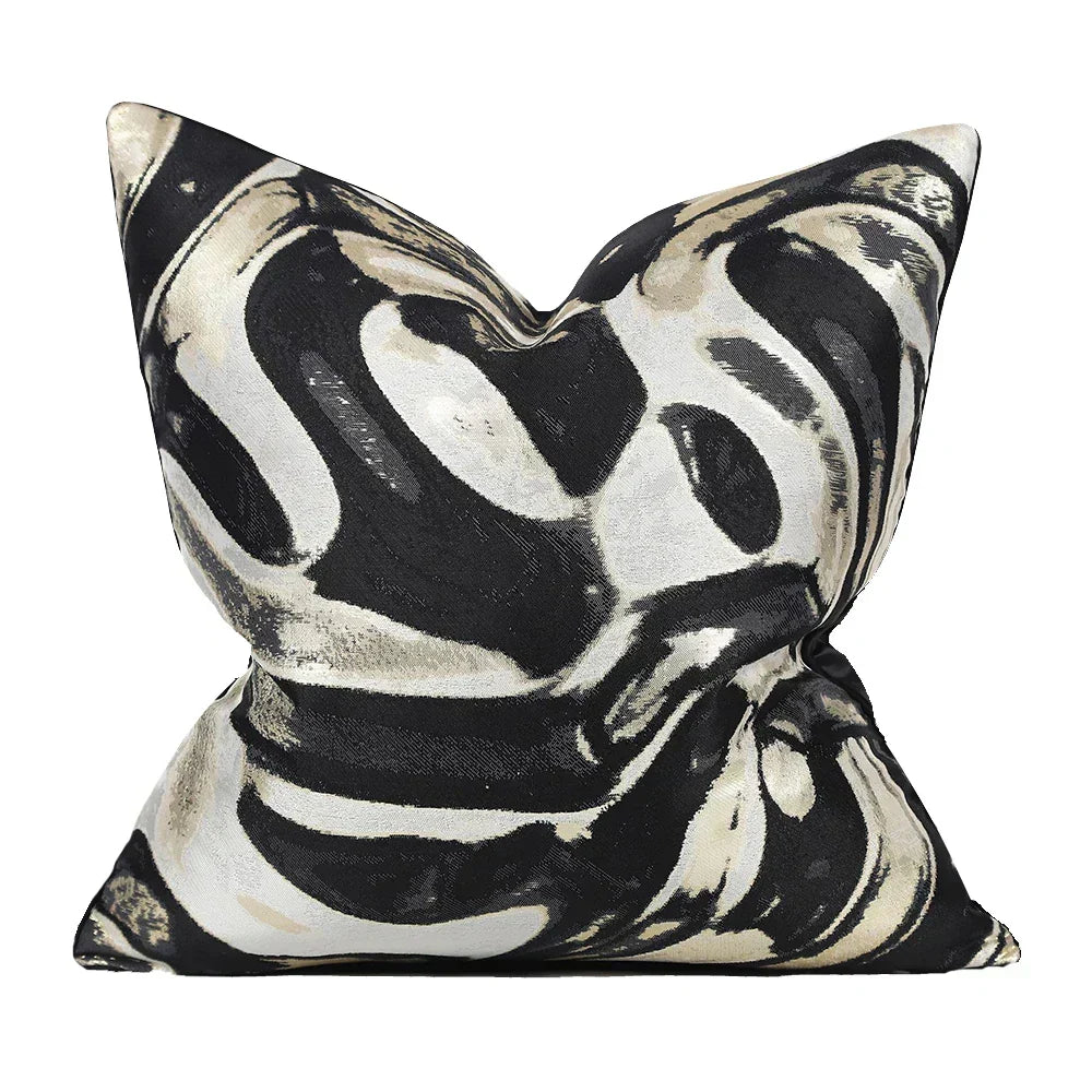 Black and white abstract pattern cushion cover displayed on a pillow insert