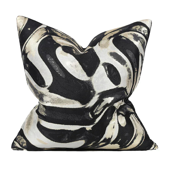 Black and white abstract pattern cushion cover displayed on a pillow insert