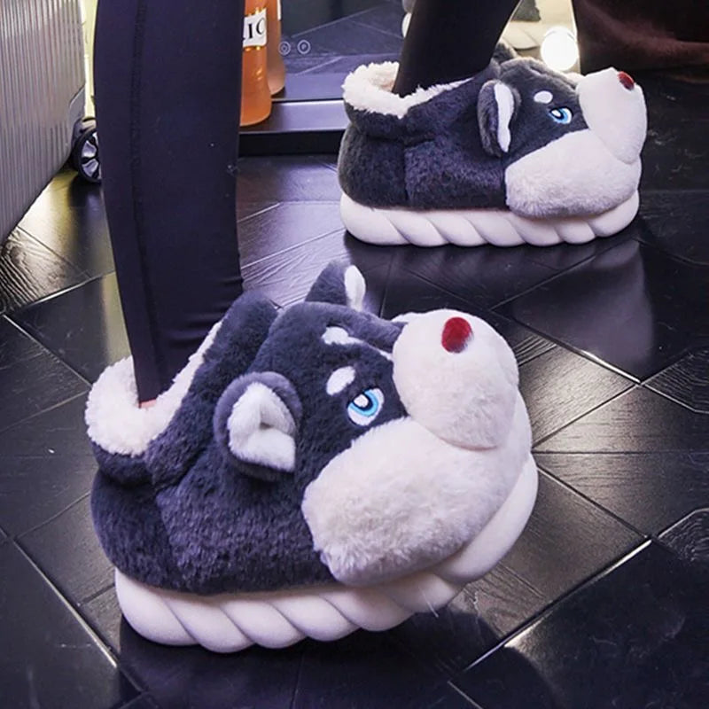 Person wearing dark grey high-top husky slippers indoors on a dark floor.