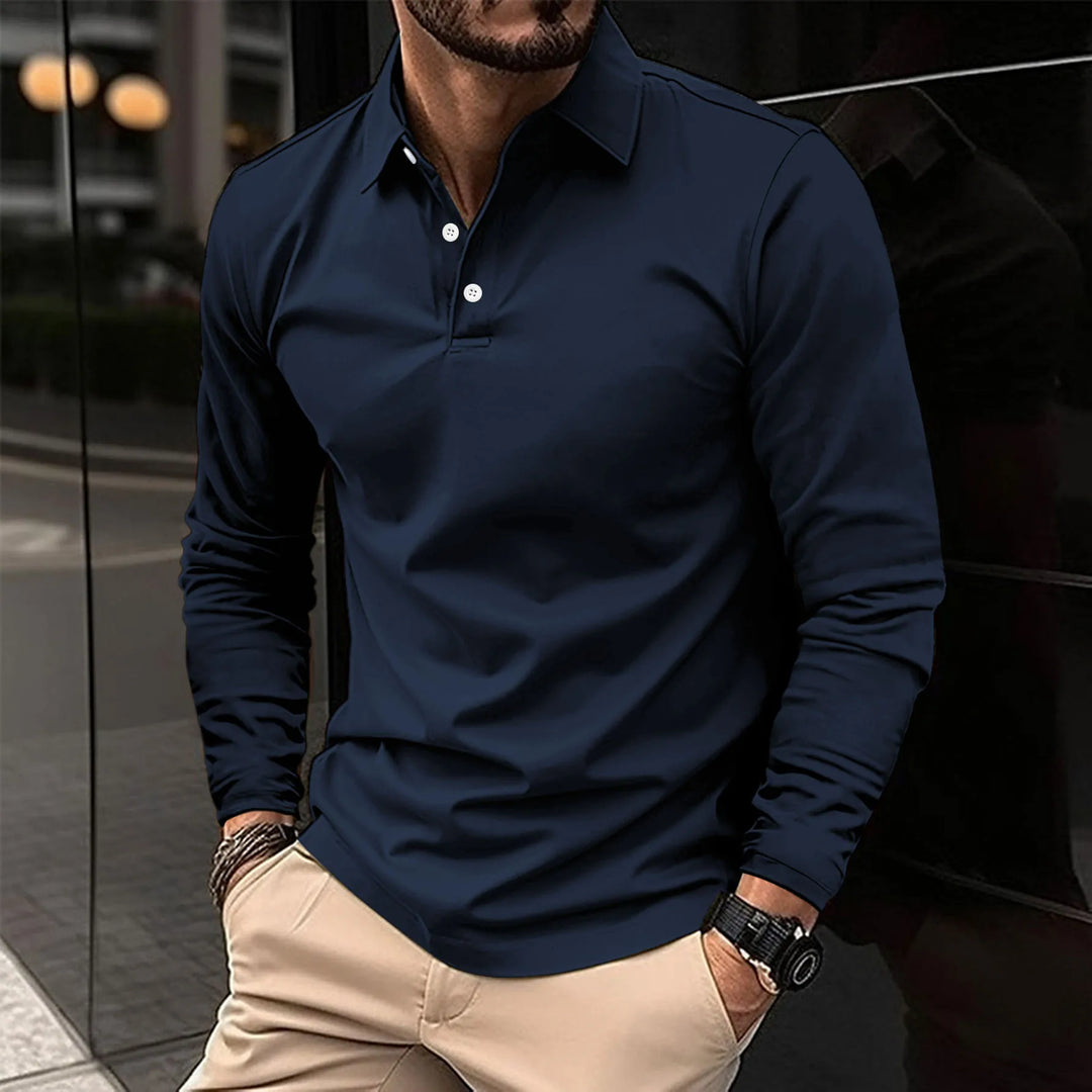 Man wearing navy blue long-sleeved polo shirt with khaki trousers