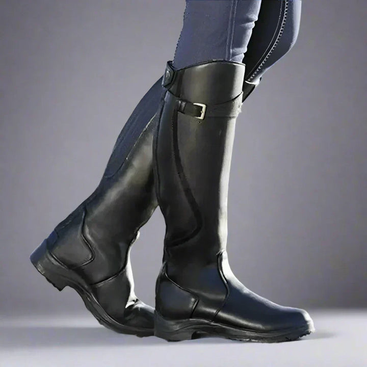 Side profile of black equestrian tall boots for women with secure calf closure