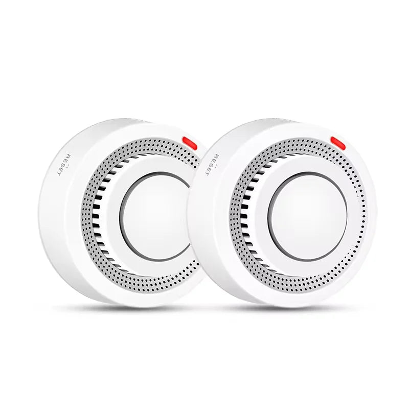 Two white smart WiFi smoke detectors shown side by side