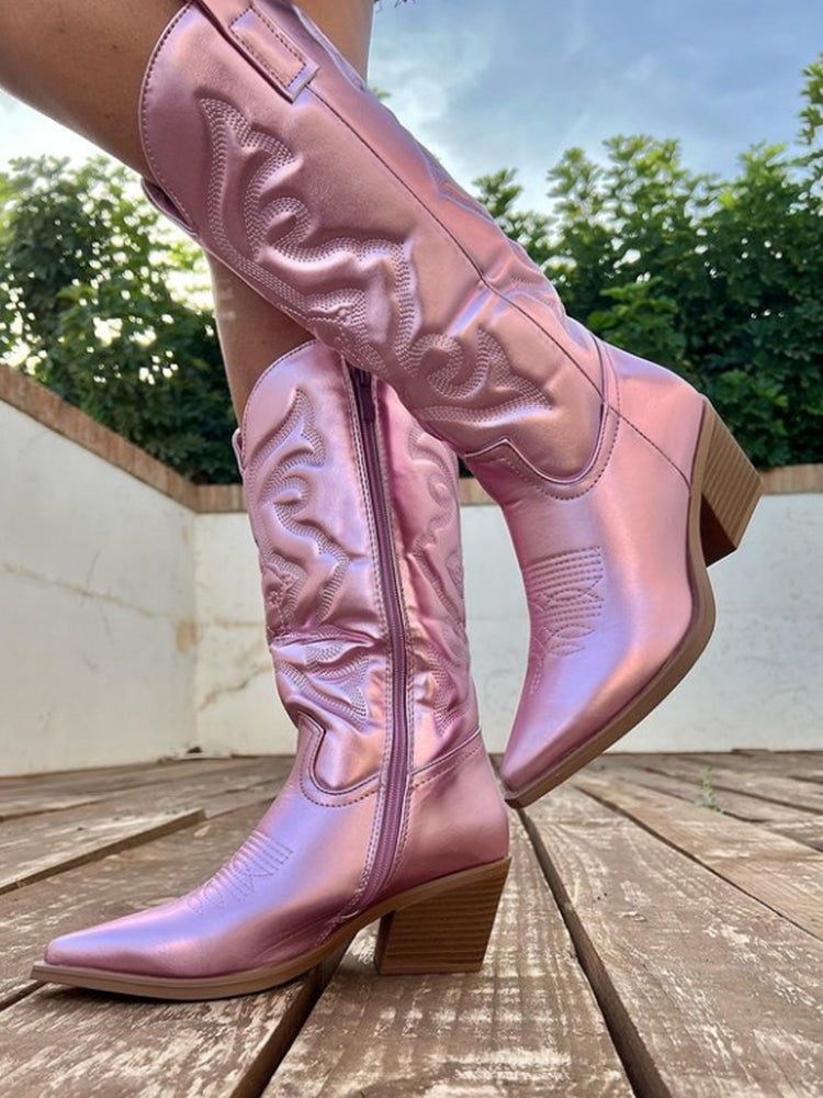 Full length view of shiny western boots paired with trendy festival wear