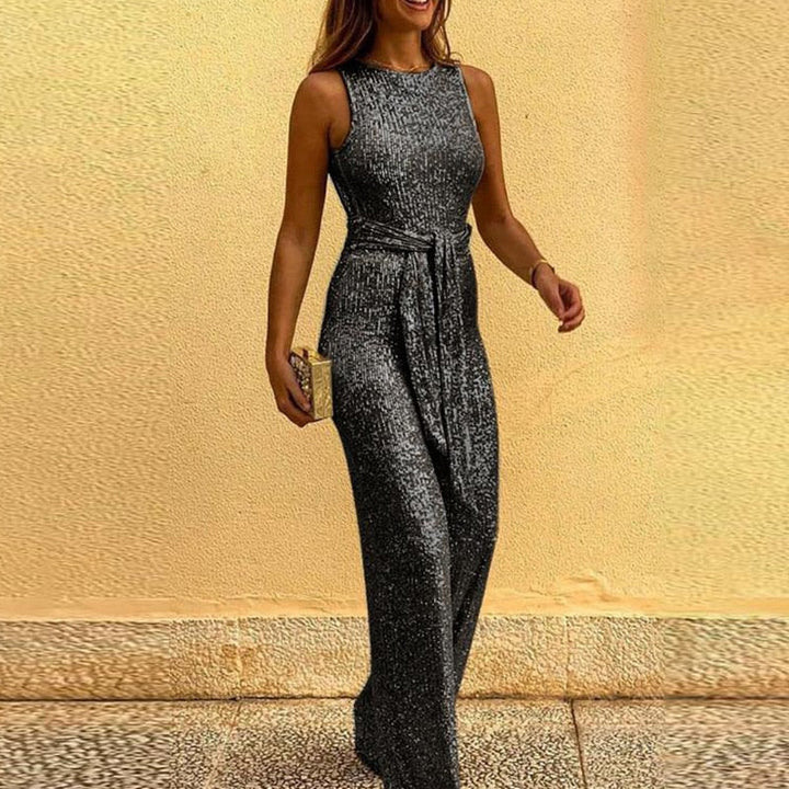 Woman showcasing a sleek grey evening jumpsuit