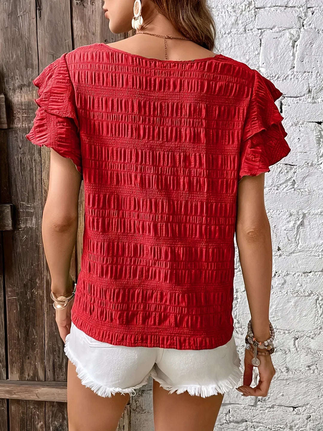 Close up fabric detail of the womens ruffle sleeve casual shirt