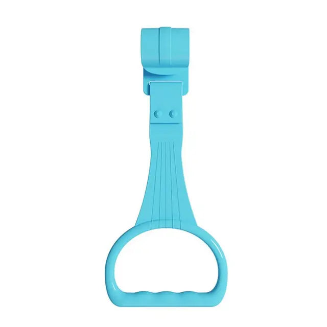 Baby learning to stand using colorful crib pull rings in nursery setting