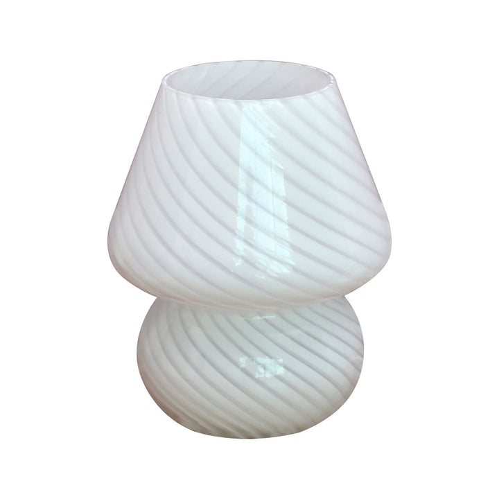 Vintage glass mushroom lamp illuminating a living room shelf as warm home decor