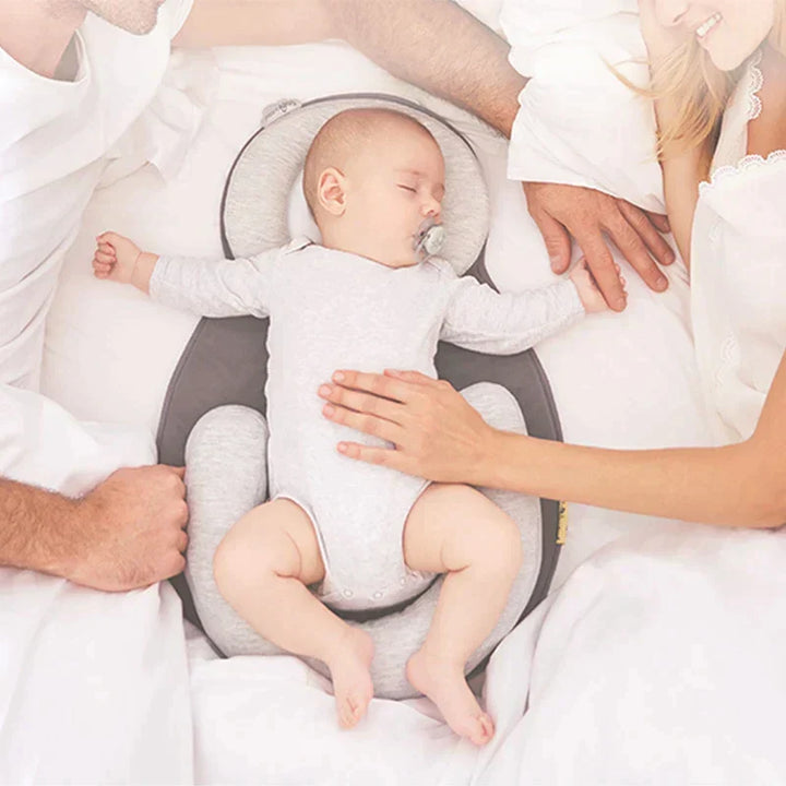 Side profile of baby support pillow showcasing ergonomic curve for restful naps